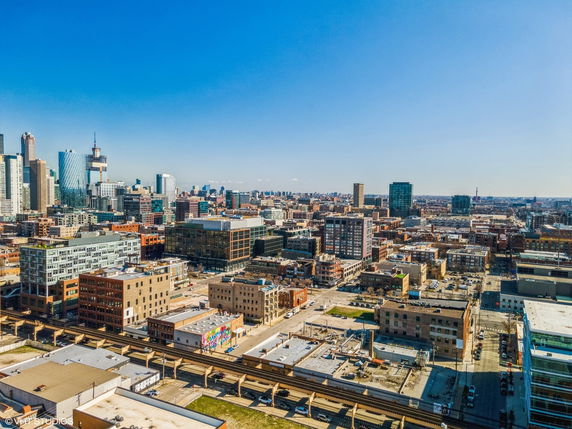 Wide angle view of a cityscape with high-rise buildings and urban infrastructure.