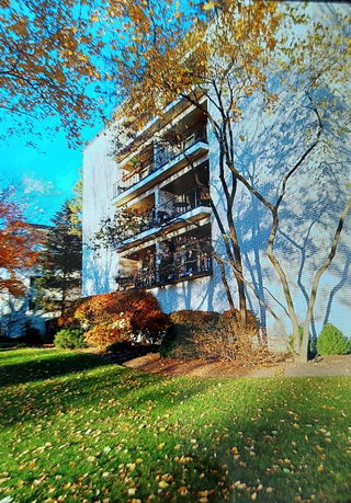 View of a multi-story building with balconies.