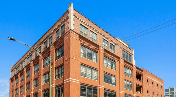 Front view of a multi-story brick building.