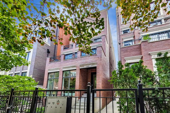 Front view of a multi-story brick building.
