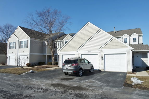 Front view of a two-story house with attached garage.