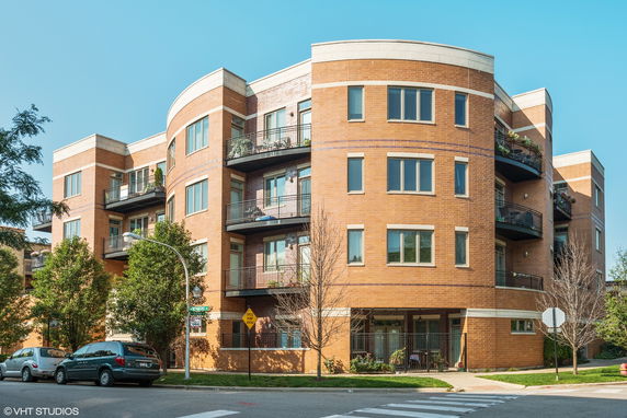 Front view of a multi-story brick apartment building