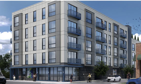 Front view of a modern multi-story building with balconies and large windows.