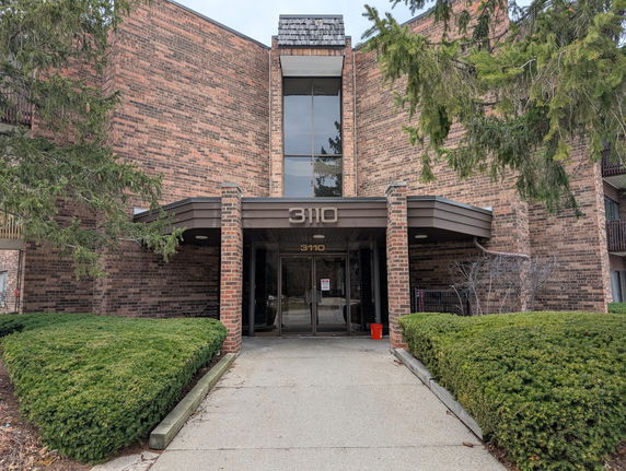 Front view of a brick building entrance.