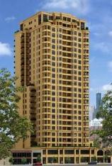 Front view of a tall, multi-story residential building.