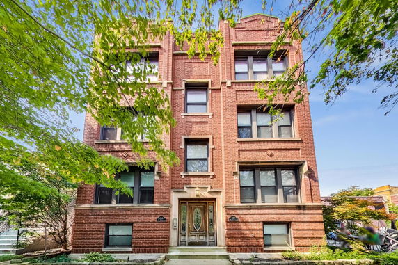 Front view of a multi-story brick building.