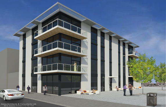 Front view of a modern multi-story building with large glass windows and balcony areas.