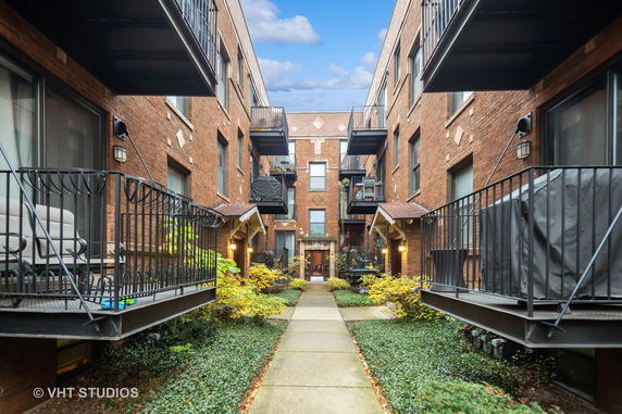Front view of brick residential building with balconies
