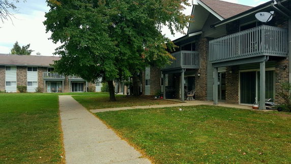 Front view of multi-story residential buildings with balconies.