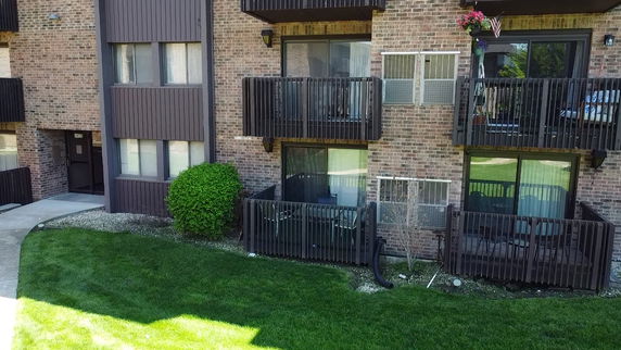 Front view of an apartment building with balconies.