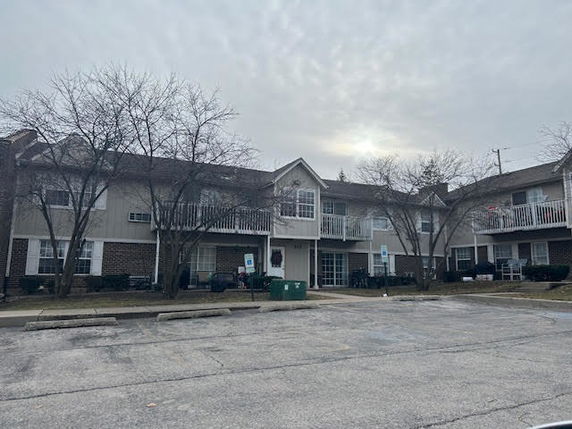 Front view of a two-story residential building with balconies.