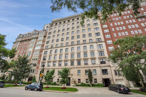 Front view of a multi-story residential building with a classical facade.