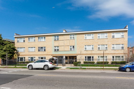 Front view of a three-story apartment building.