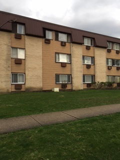 Front view of a three-story residential building.