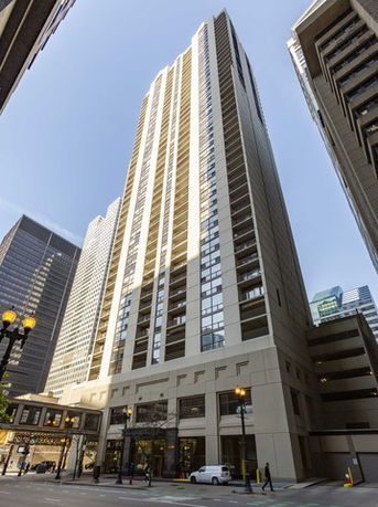 Front view of a tall modern high-rise building.