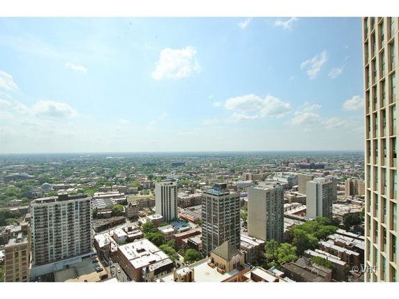 Panoramic view of a cityscape with multiple tall buildings.