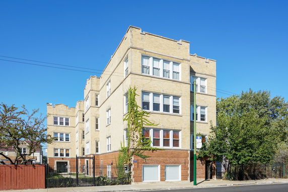 Front view of a multi-story brick apartment building