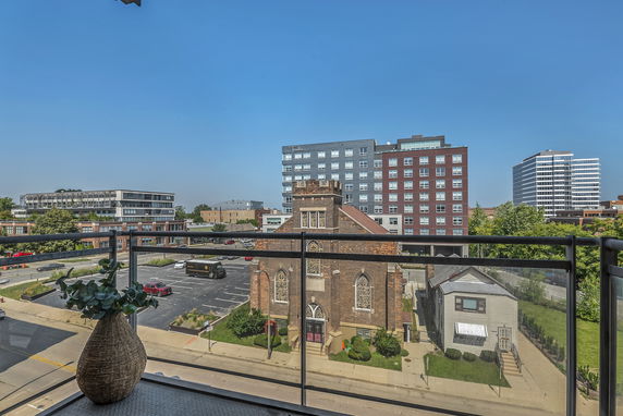 View of multiple urban buildings from a balcony.