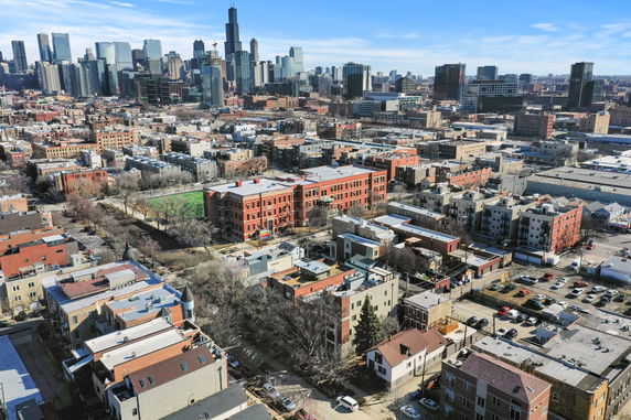 Panoramic view of a cityscape with multiple buildings and skyline.