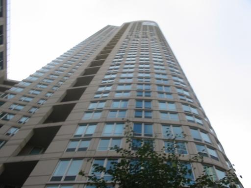 Upwards view of a high-rise building with many windows.