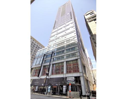 Front view of a modern high-rise building with glass facade.