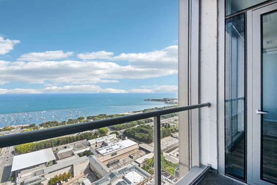 Panoramic view of the ocean and surrounding area from a building balcony.
