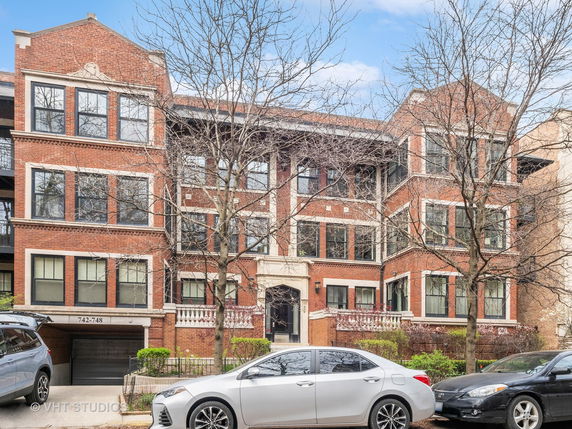 Front view of a multi-story brick building.