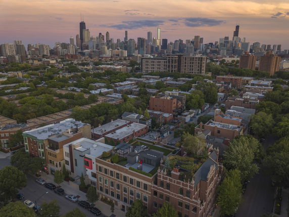 Panoramic view of a cityscape with buildings extending towards the skyline.