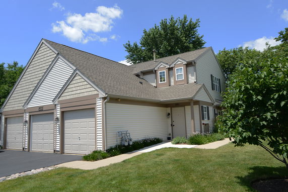 Front view of a two-story house with a double garage.