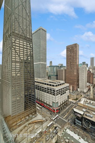 Panoramic view of a cityscape with high-rise buildings.