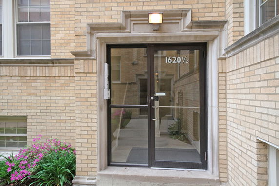 Front view of a building with a glass door entrance.