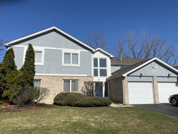 Front view of a two-story house with a double garage.