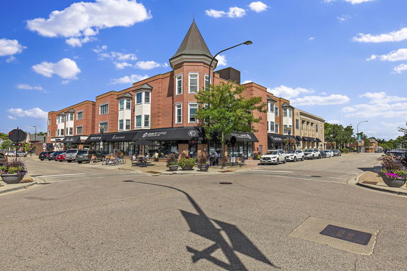 Front view of a multi-story commercial building on a street corner.