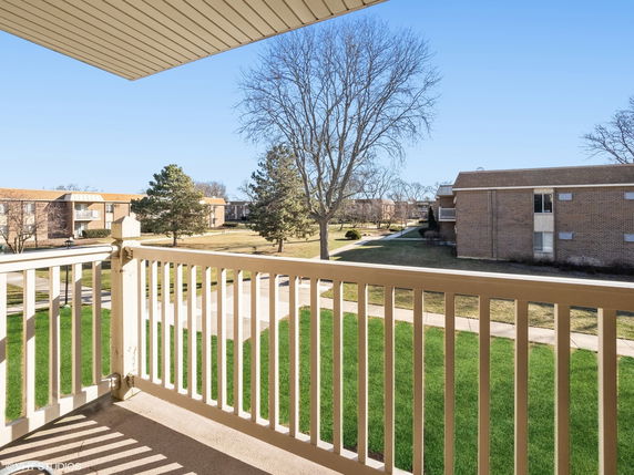 View of surrounding residential buildings from a balcony.