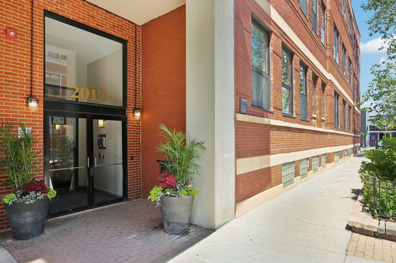 Front view of a building entrance with number 2012 on a door.
