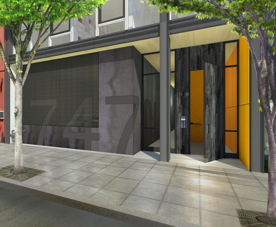 Front view of a modern building with a glass entrance and large number 747 on the facade.
