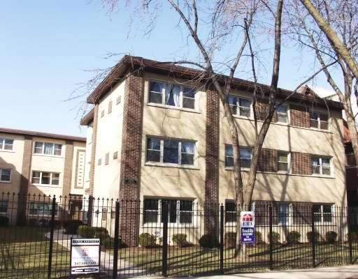Front view of a multi-story apartment building.