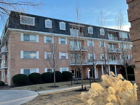 Front view of a multi-story residential building.