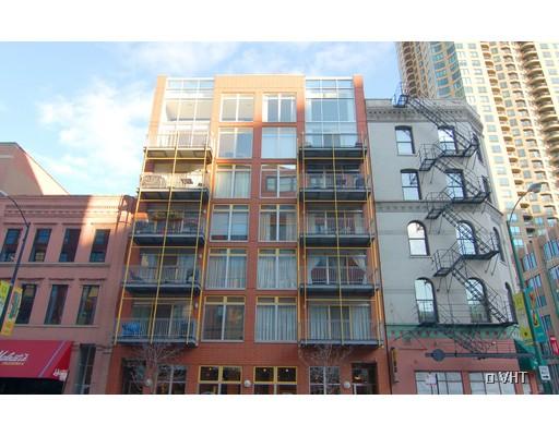 Front view of a multi-story residential building with balconies.