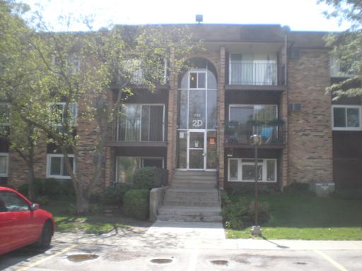 Front view of a multi-story brick building.