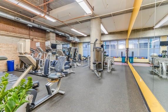 Interior view of a gym with exercise equipment.