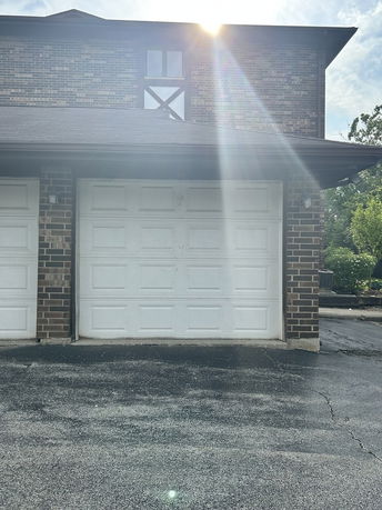 Front view of a house with a garage.