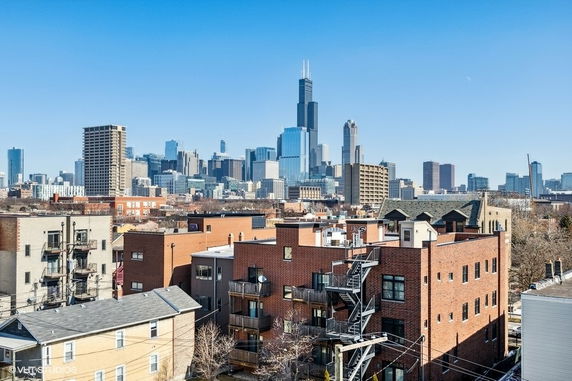 Panoramic view of a cityscape with multiple high-rise buildings.