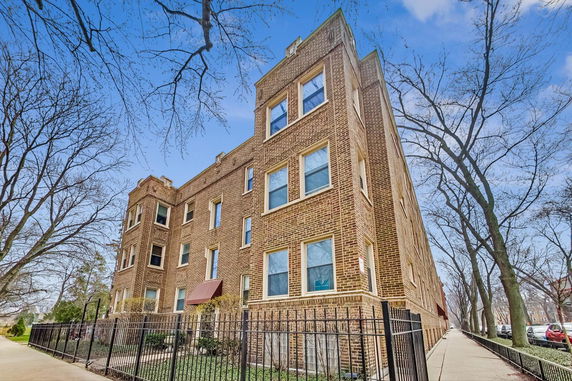Front view of a multi-story brick building.