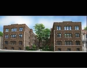 Front view of a multi-story brick apartment building.