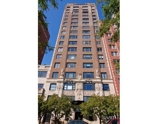 Front view of a tall multi-story apartment building.