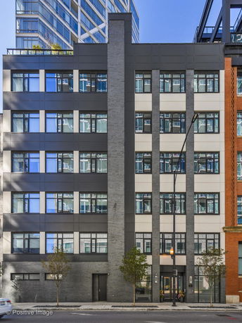 Front view of a multi-story building with a modern facade.