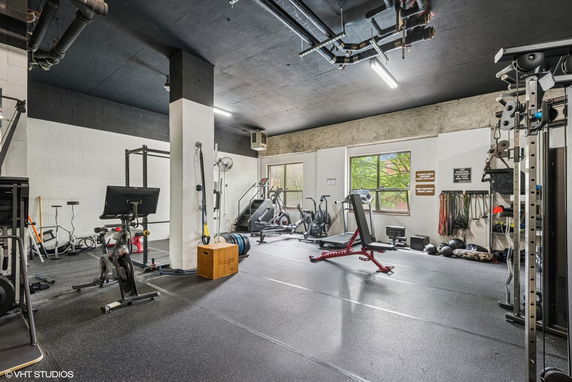 Interior view of a gym with various exercise equipment.
