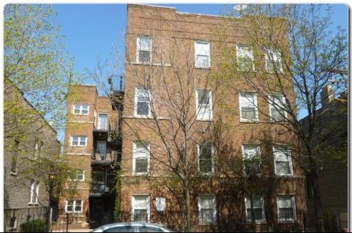 Front view of a multi-story brick apartment building