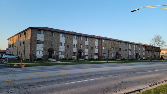 Front view of a multi-story apartment building.